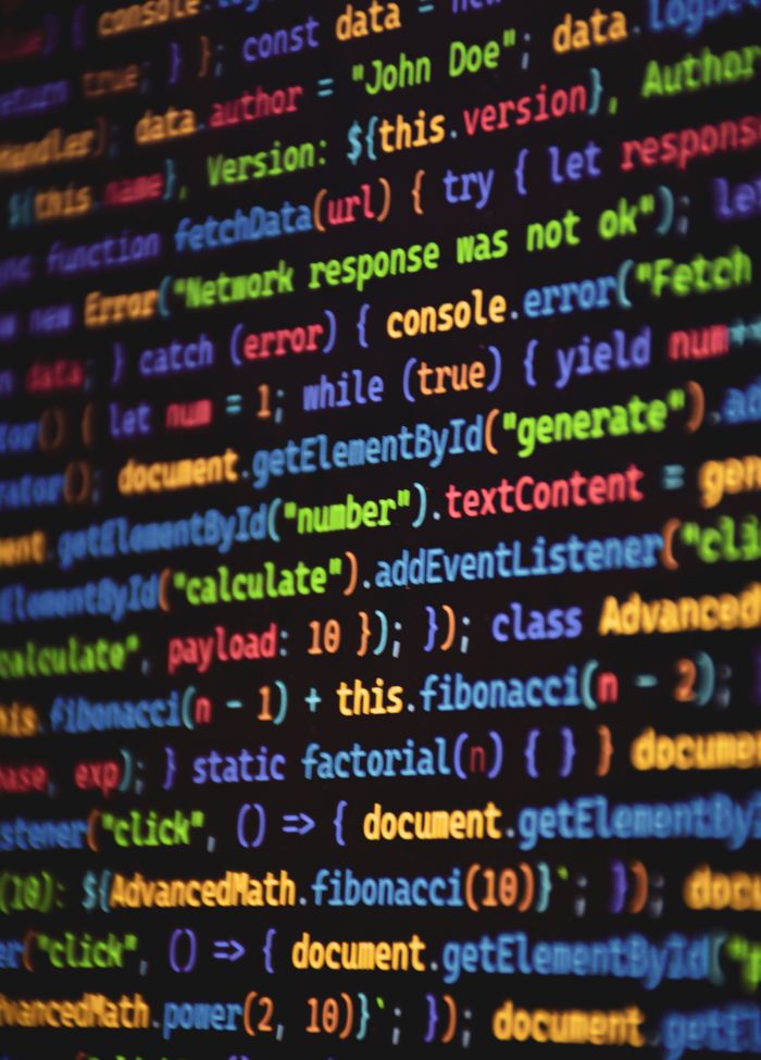 about-06 Close-up of vibrant colored JavaScript code showing functions and syntax on a dark screen.